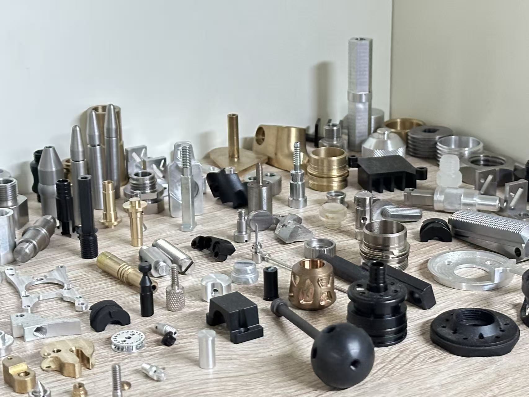 Precision metal and engineering-plastic components in multiple production materials