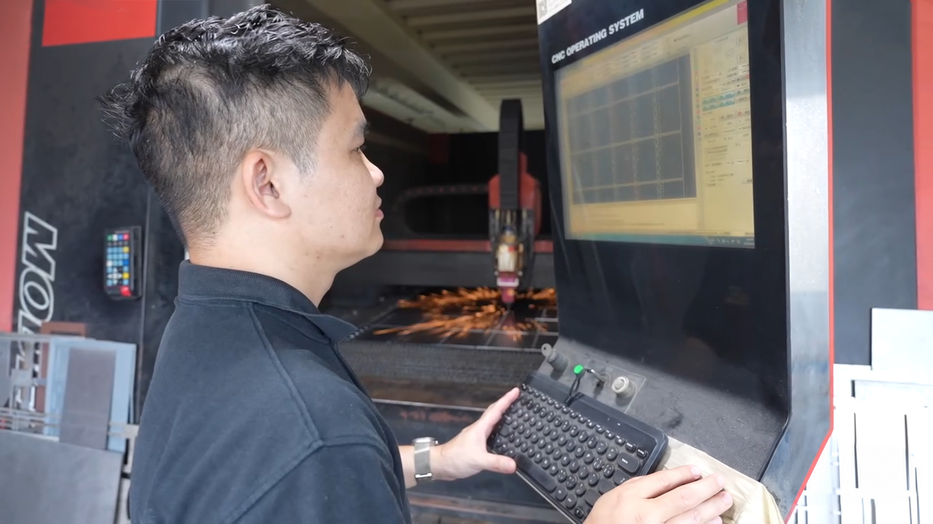 T-One CNC operator monitoring production